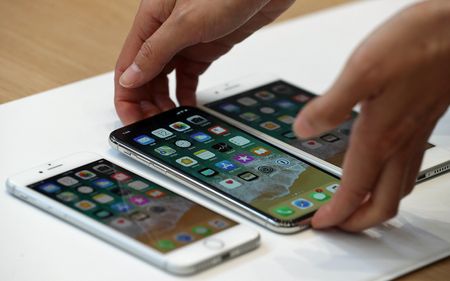 CUPERTINO, CA - SEPTEMBER 12:(L-R) The new iPhone 8, iPhone X and iPhone 8S are displayed during an Apple special event at the Steve Jobs Theatre on the Apple Park campus on September 12, 201