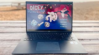 LG Gram 17 (2022) review unit on table outside, dicey dungeons game running onscreen