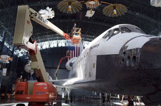 A team from the Smithsonian's Digitization Project Office scans the space shuttle Discovery in 2017. The resulting 3D digital model was released as part of Smithsonian Open Access.