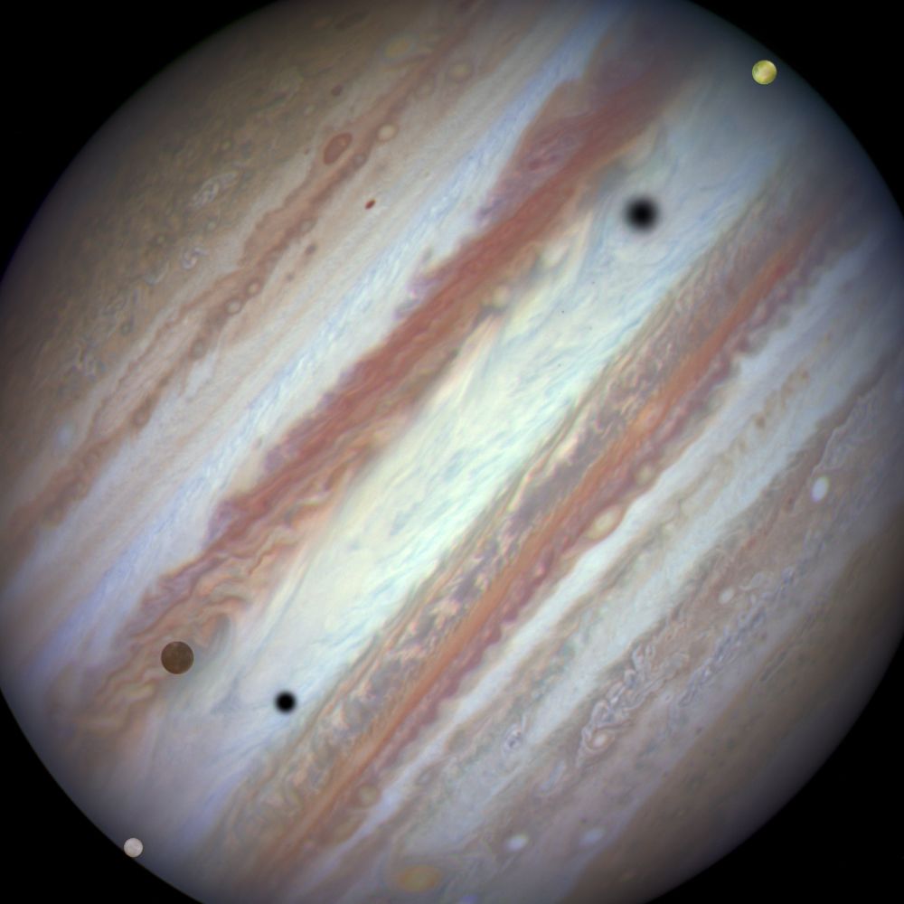 Three moons and their shadows move across Jupiter during a rare triple transit on Jan. 24, 2015. Europa is at lower left, Callisto is above and to the right of Europa and Io is approaching Jupiter&#039;s eastern limb. Europa&#039;s shadow is toward the left side of the image and Callisto&#039;s shadow to the right.