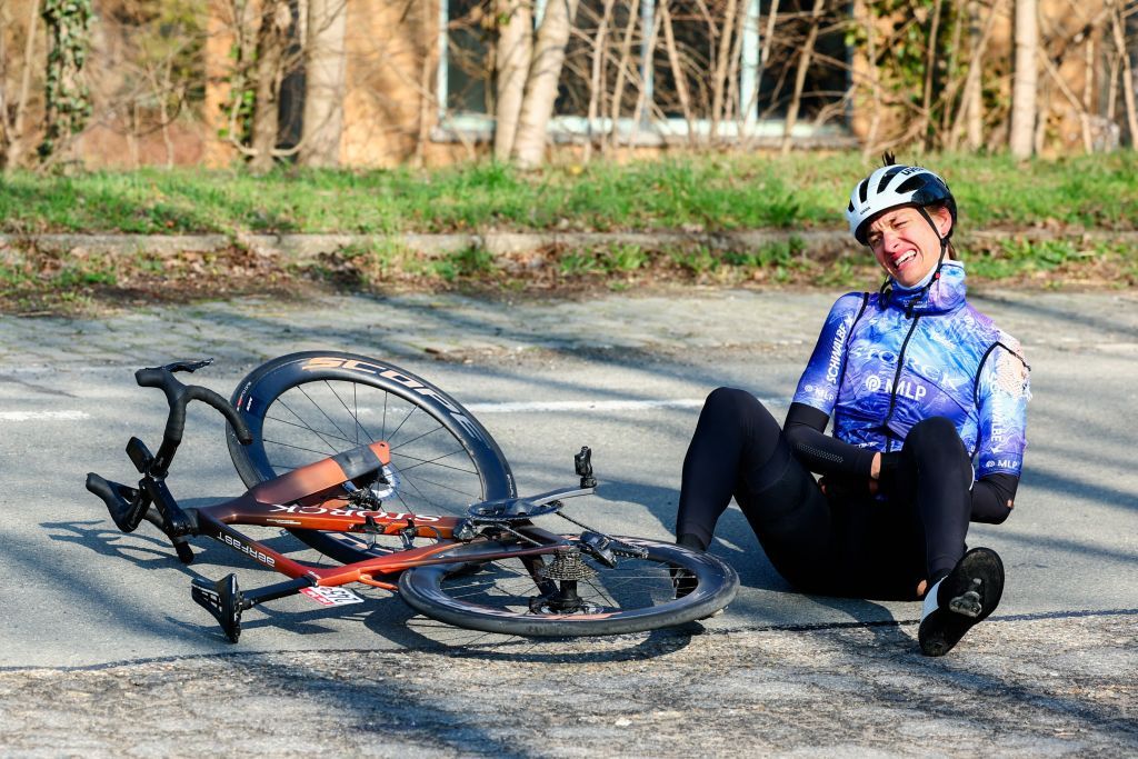 German cyclist Linus Scheitinger of Team Storck - Metropol Cycling lies injured on the ground in the 'Grand Prix du Samyn' the first of 10 races in the Lotto Cycling Cup, a one day 202km race, from Quaregnon to Dour on February 27, 2024. (Photo by DAVID PINTENS / Belga / AFP) / Belgium OUT