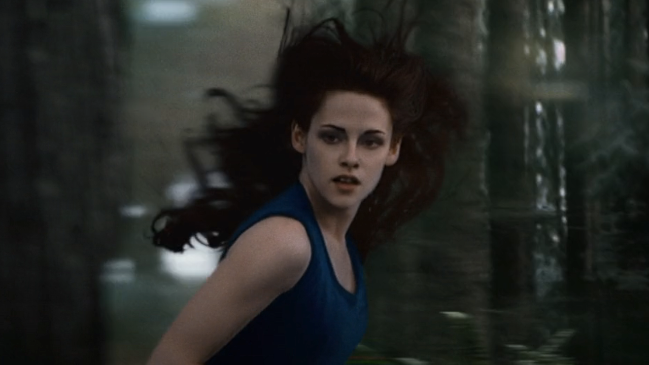 Kristen Stewart as vampire Bella running through the woods