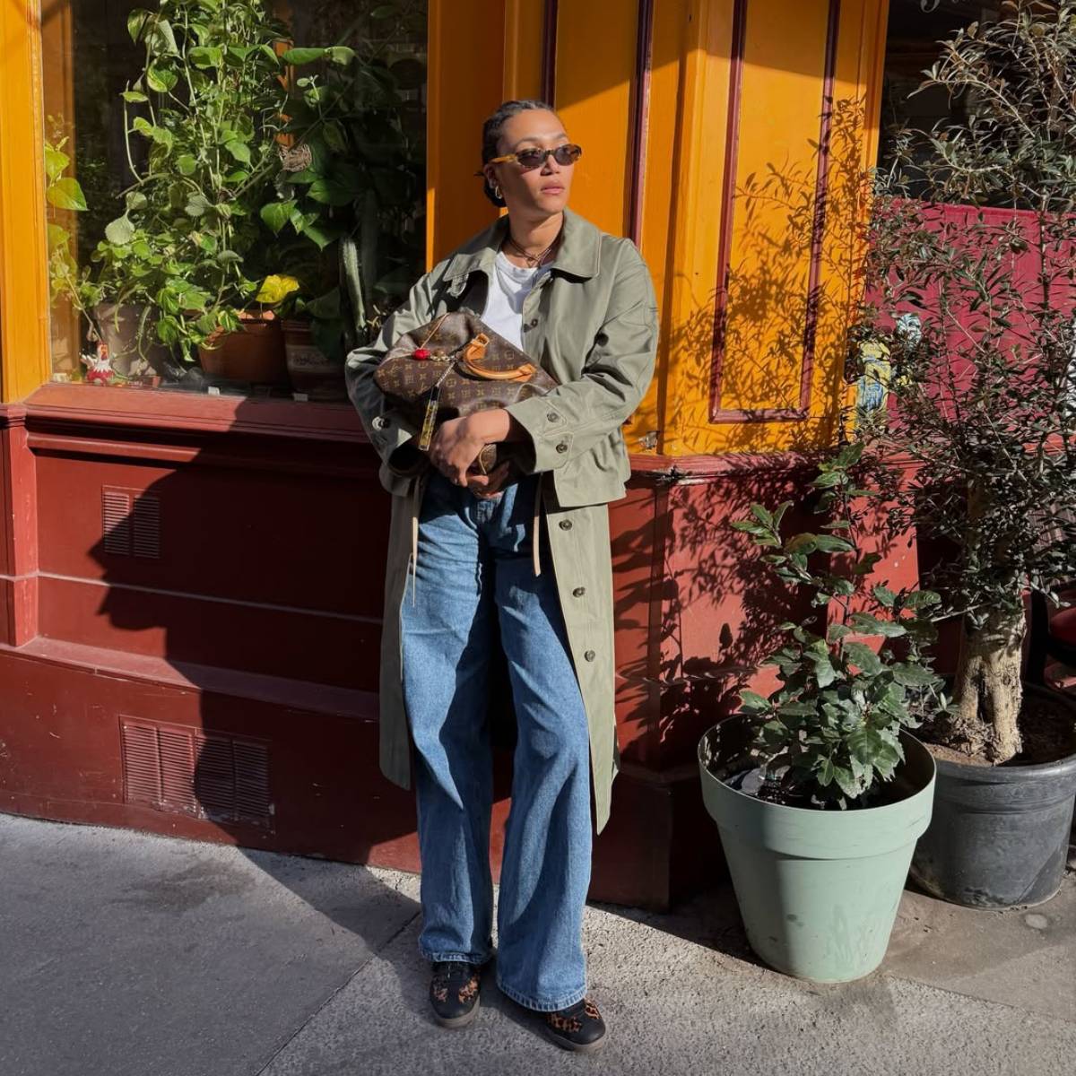 Lena wearing animal print trainers