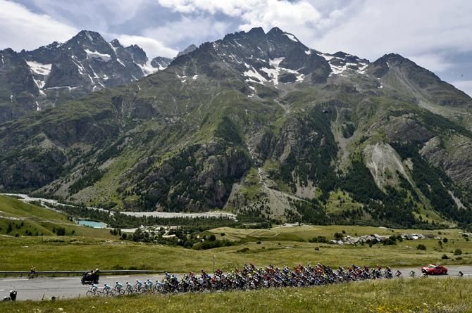 The high alps surround the peloton on stage 14