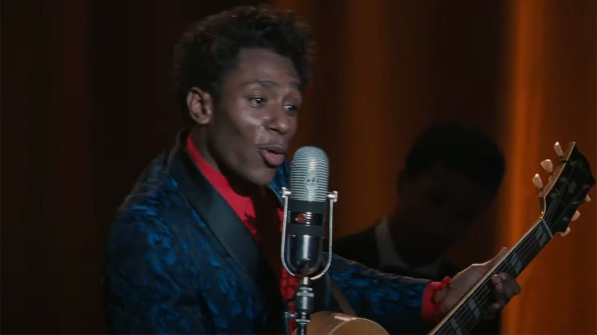 Mos Def onstage in blue blazer as Chuck Berry in Cadillac Records. 