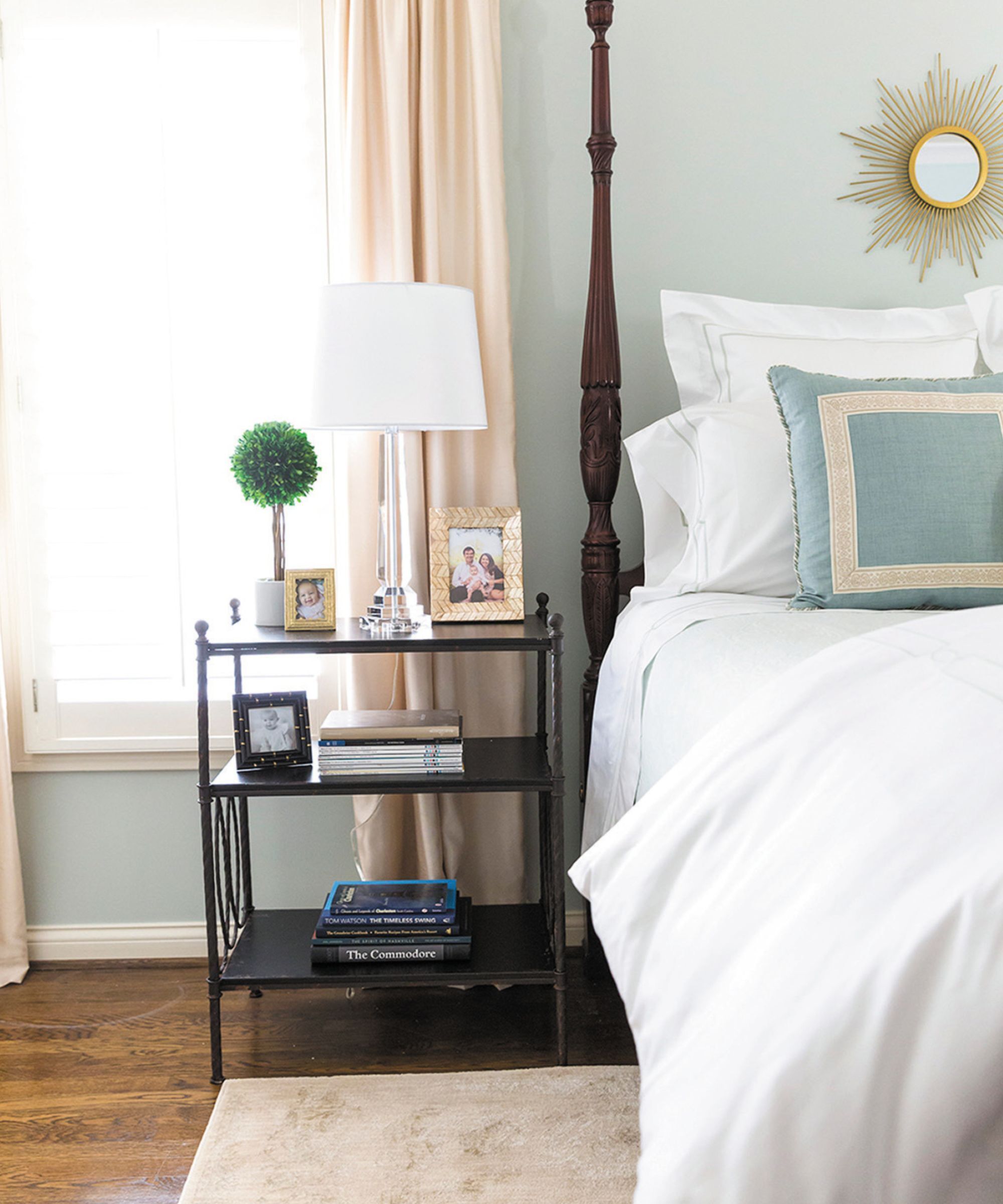 A bedroom painted in mint green