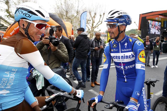 Romain Bardet (AG2R La Mondiale) and Deceuninck-QuickStep's Julian Alaphilippe share a joke ahead of stage 3 of the 2019 Criterium du Dauphine