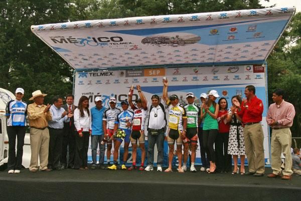 The jersey wearers celebrate on the podium