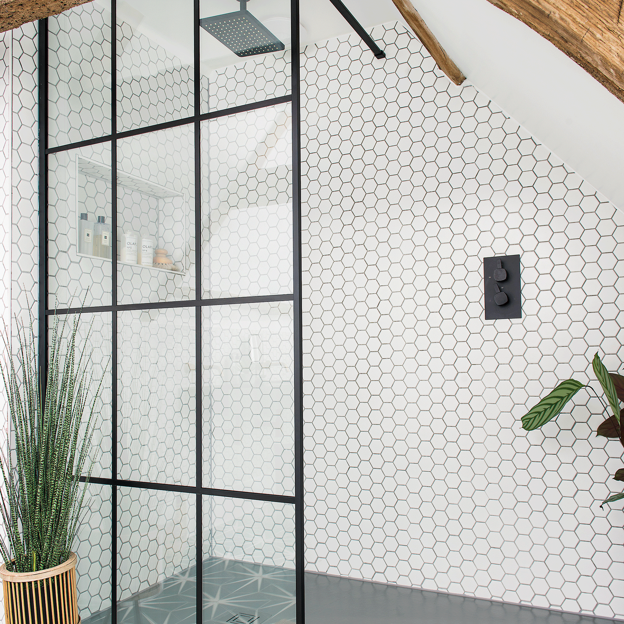 Walk in shower with hexagon tiles