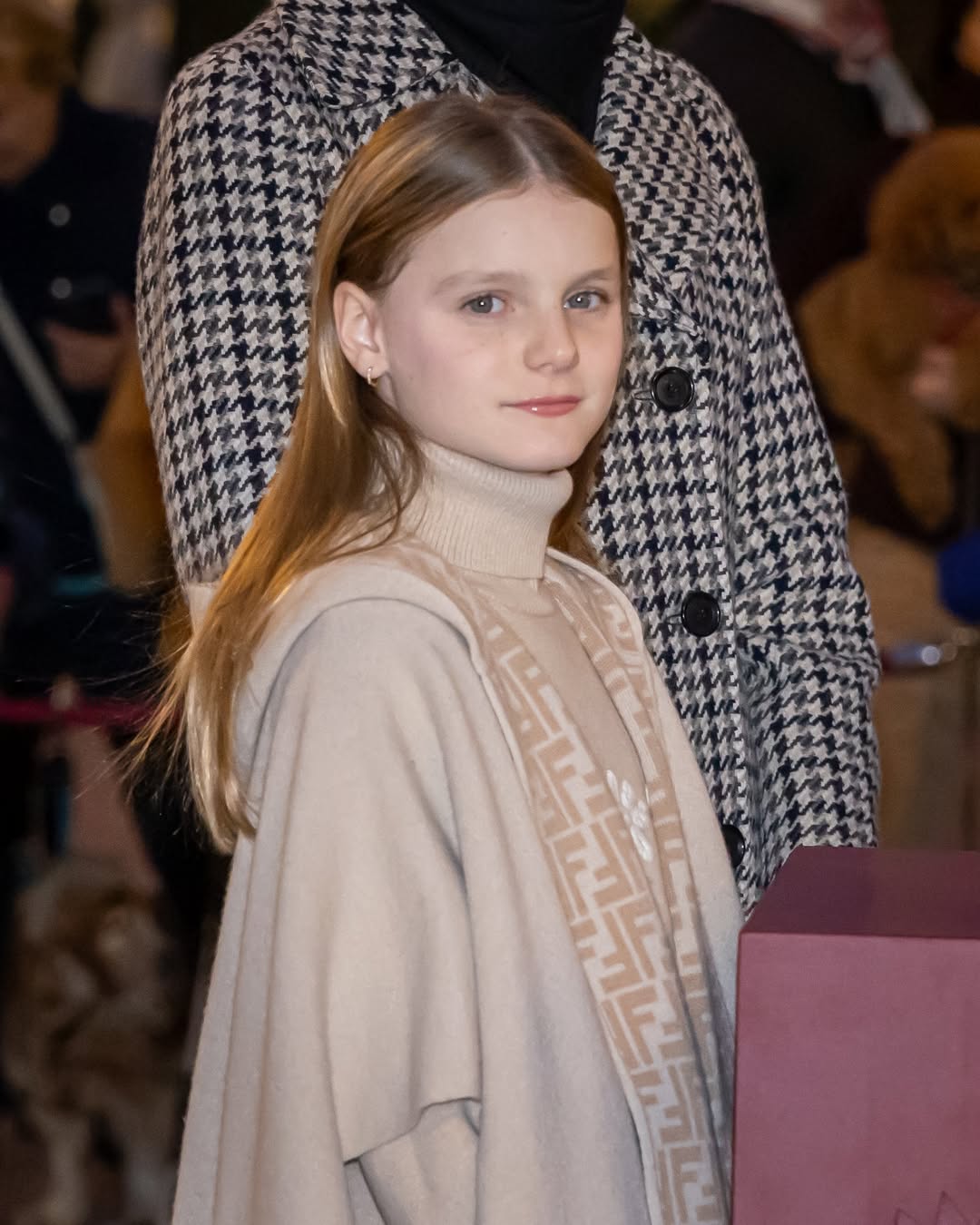 Princess Gabriella wearing a tan cape