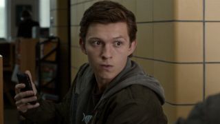 Peter Parker (Tom Holland) prepares to leave a room in Spider-Man: Homecoming