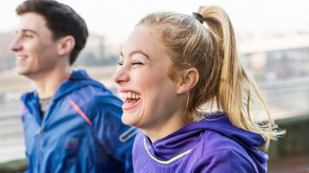 Man and woman running outdoors