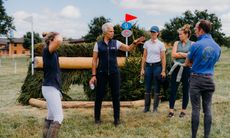 The late Caroline Moore coaching riders while walking a cross-country course