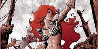 Red Sonja rising up, weapons in hand