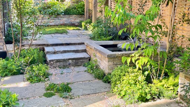 patchwork patio with soft planting around paving