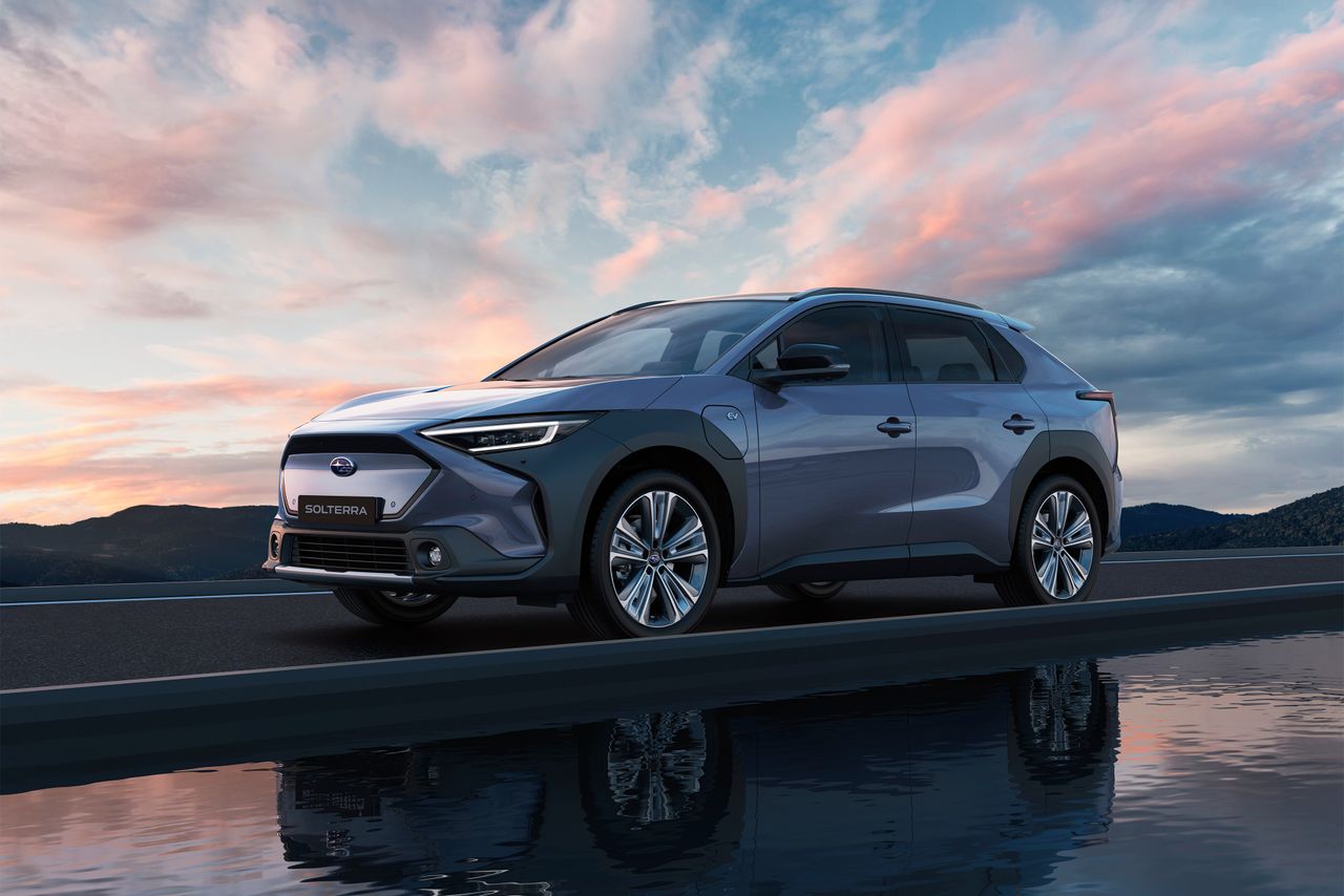 Subaru Solterra EV on road with sunset backdrop