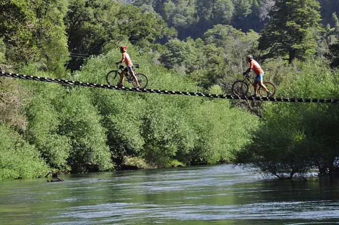 Two racers cross a bridge in the Trans Andes