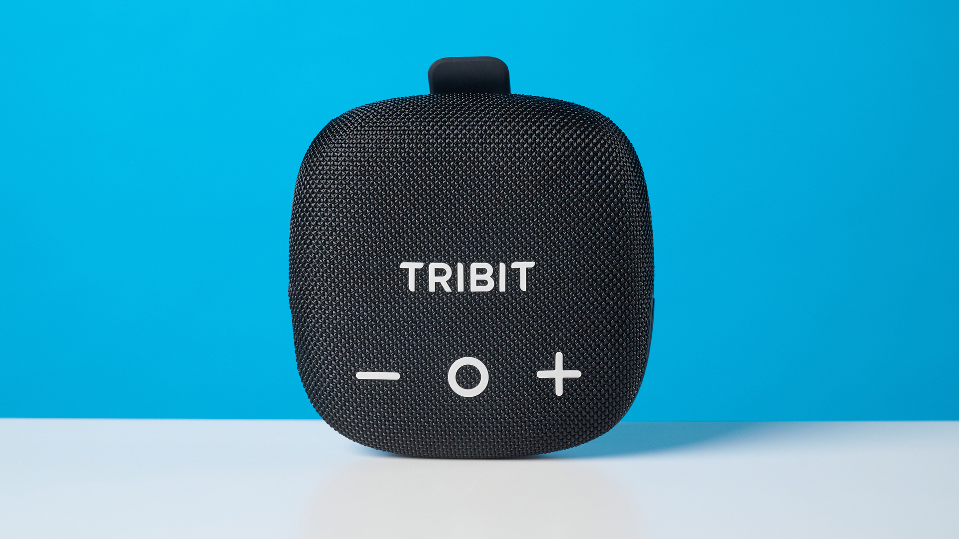 Tribit StormBox Micro 3 in black photographed in front of a blue background