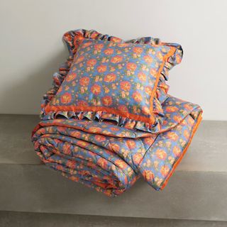 Blue and orange floral cushion