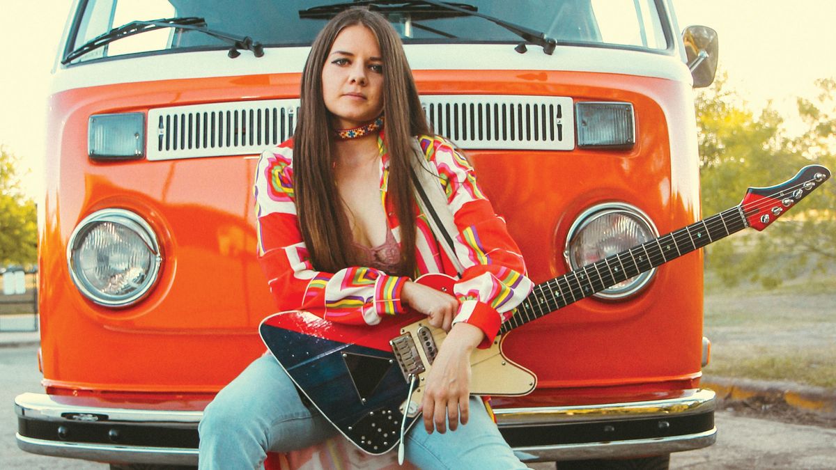 Arielle with Two Tone guitar and 1973 &#039;Magick&#039; VW bus