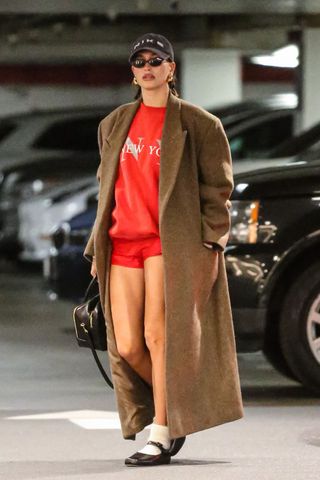 Hailey Bieber in red shorts GettyImages-1848360868