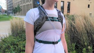 Woman wearing Nathan Crossover Pack 10L running backpack