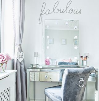 Hollywood style bedroom mirror with lights above dressing table