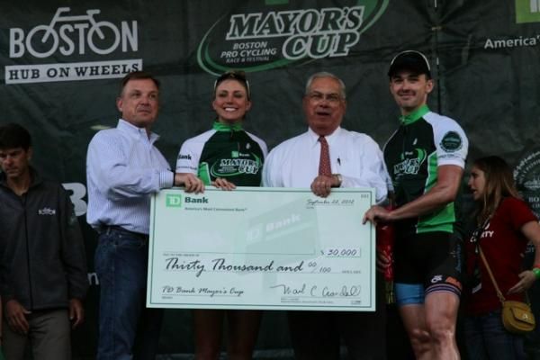 Thomas Menino, mayor of Boston, presents the big check.