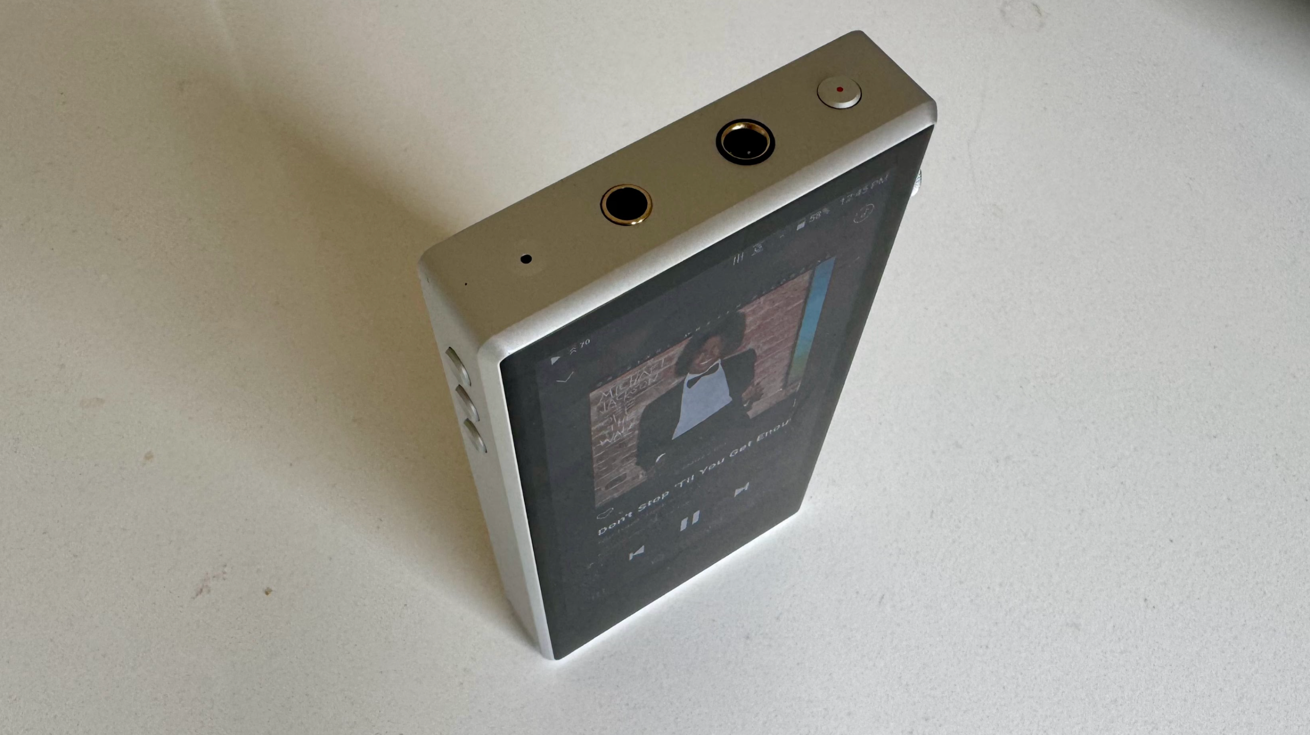 Astell &amp;amp; Kern's PD5 player on a gray table, showing details of the player