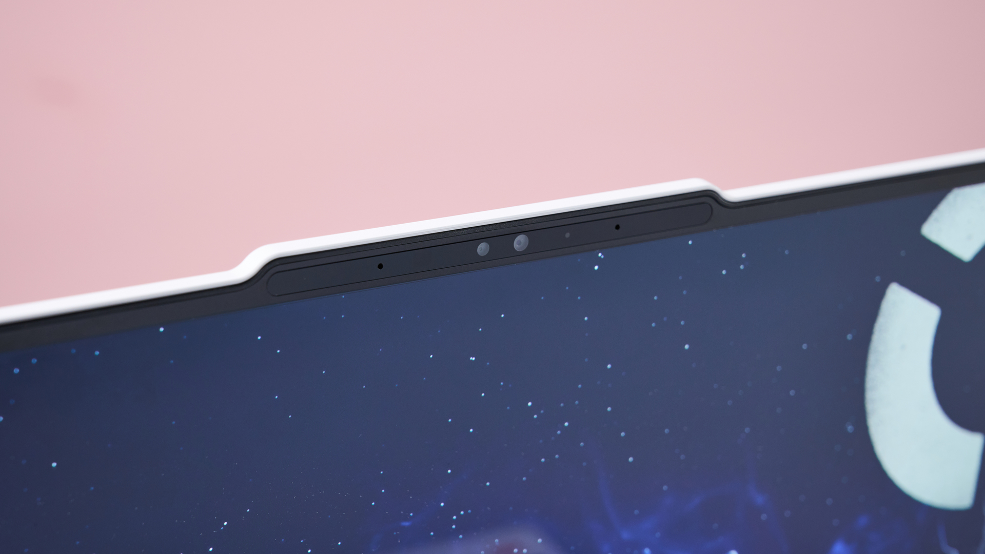 Close-up of webcam on Lenovo Legion 7i Gen 10 with pink wall in background