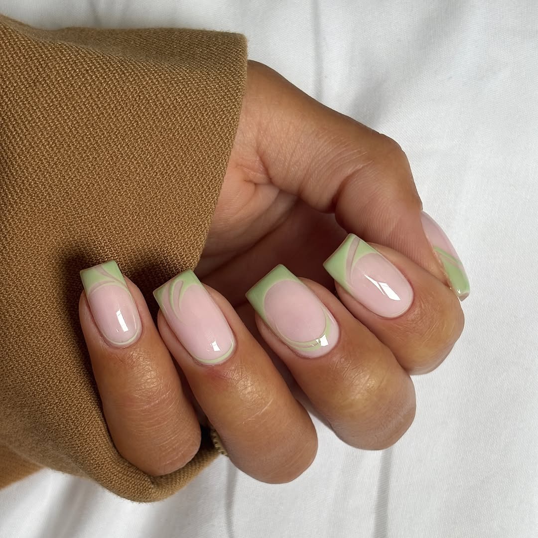 Abstract sage green French tips.