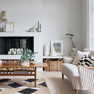 white living room with fire place and sofa