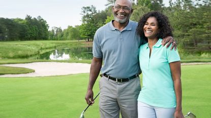 Happy couple pictured on a golf course