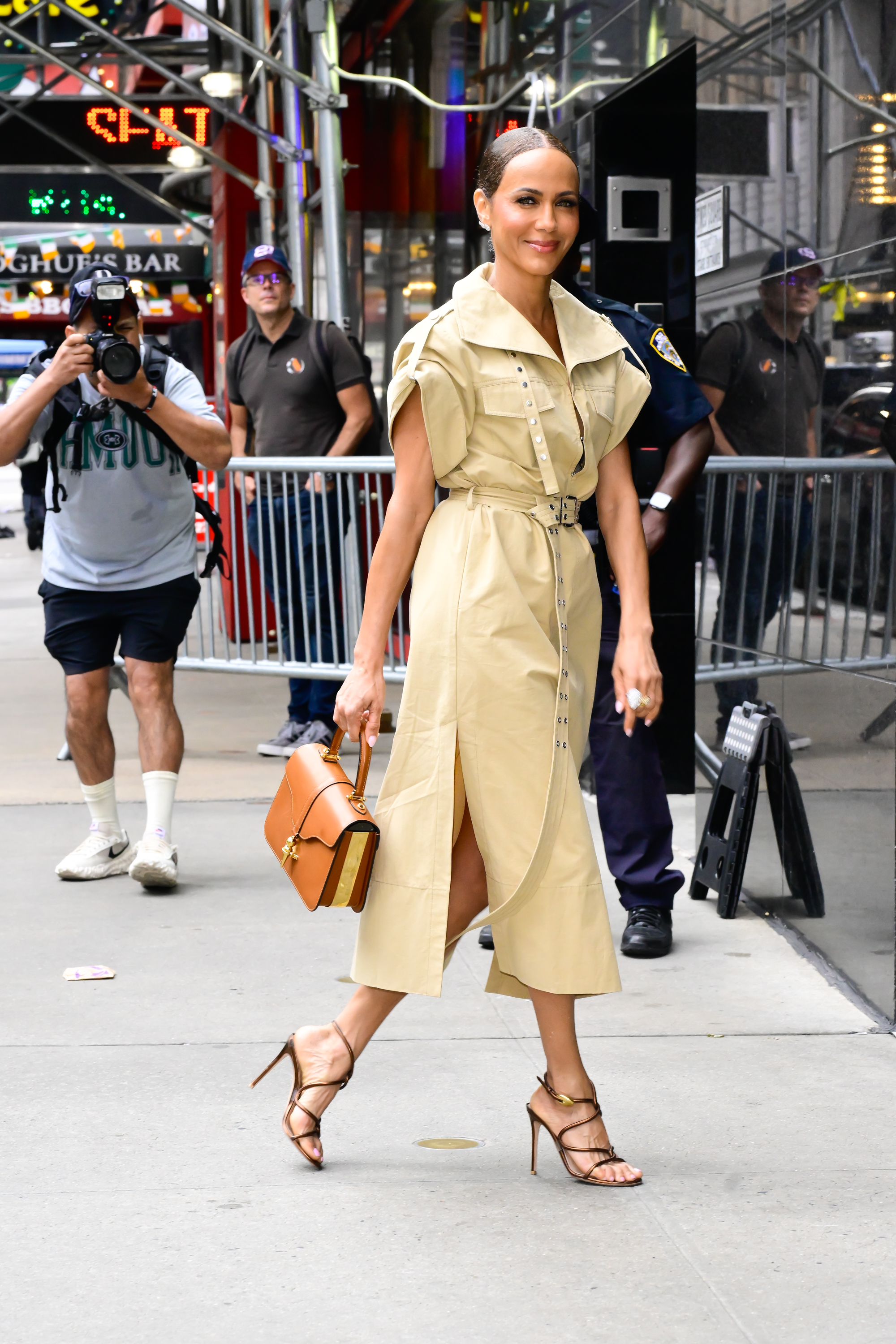 Nicole Ari Parker in a slicked-back bun