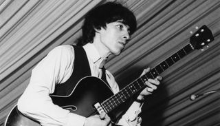 Bill Wyman performs with the Rolling Stones at the 4th National Jazz and Blues Festival in Richmond, London, in 1964