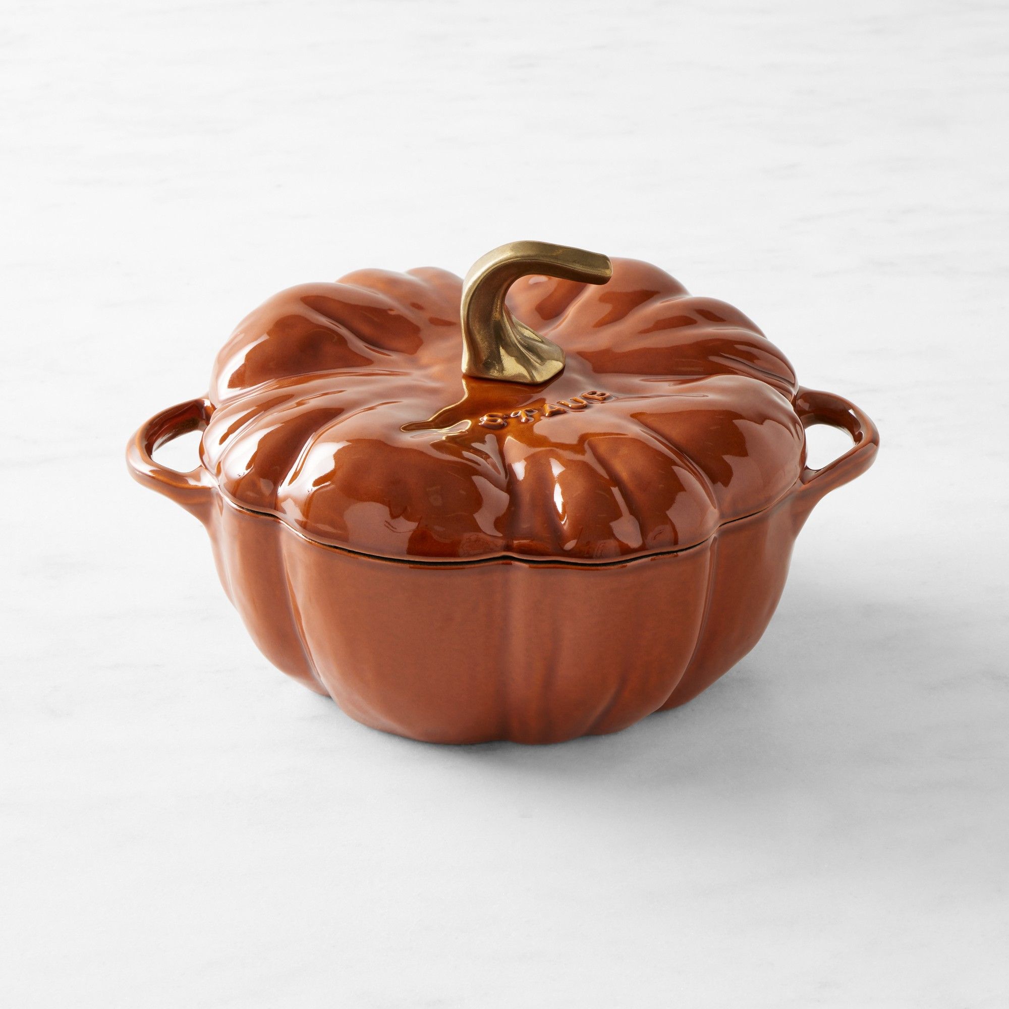 An orange pumpkin cocotte dish.