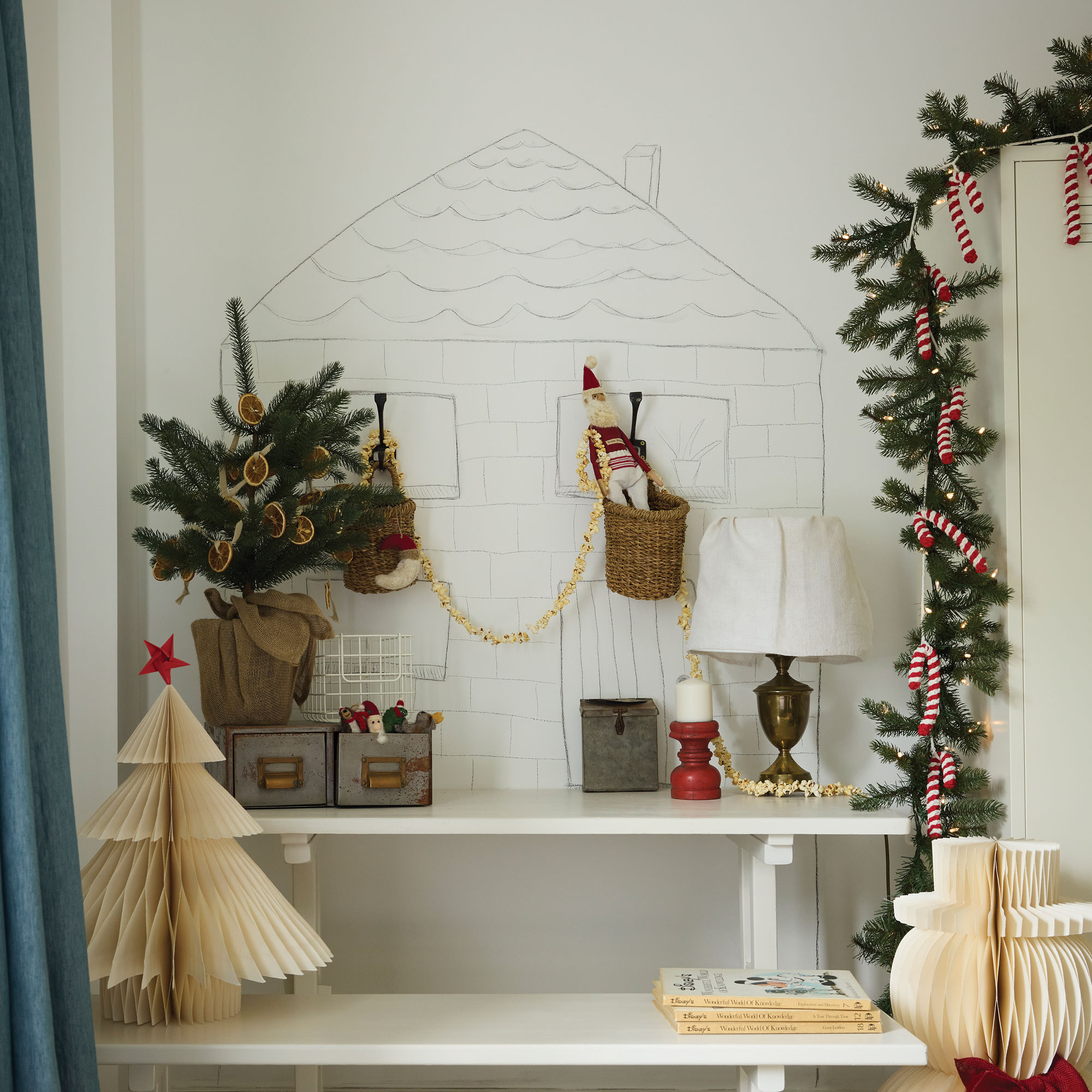 White wall with charcoal house, popcorn garlands and candy cane garlands
