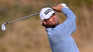 Daniel Brown, wearing baby blue, hits a shot at the Open 2026