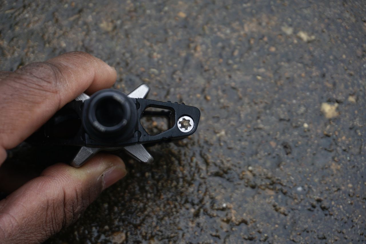 The axle of a black gravel bike pedal