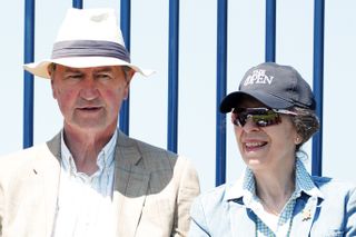 Princess Anne, Princess Royal (right) and her husband Sir Timothy Laurence watching the golf during Day Two of The 149th Open at Royal St George’s Golf Club on July 16, 2021 in Sandwich, England