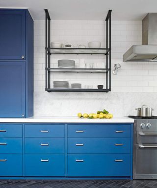 Blue kitchen with accents of white, black and stainless steel