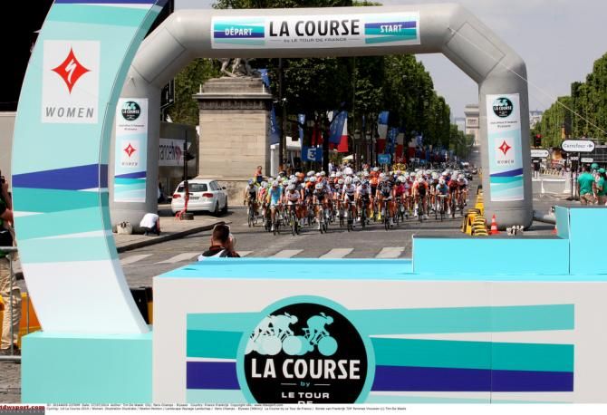 The riders pass the podium