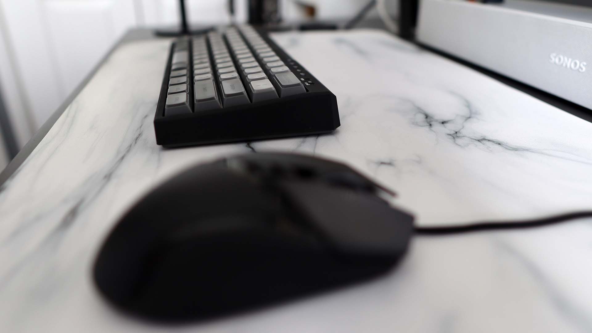 A Filco Majestouch MINILA-R gaming keyboard on a marble effect desk