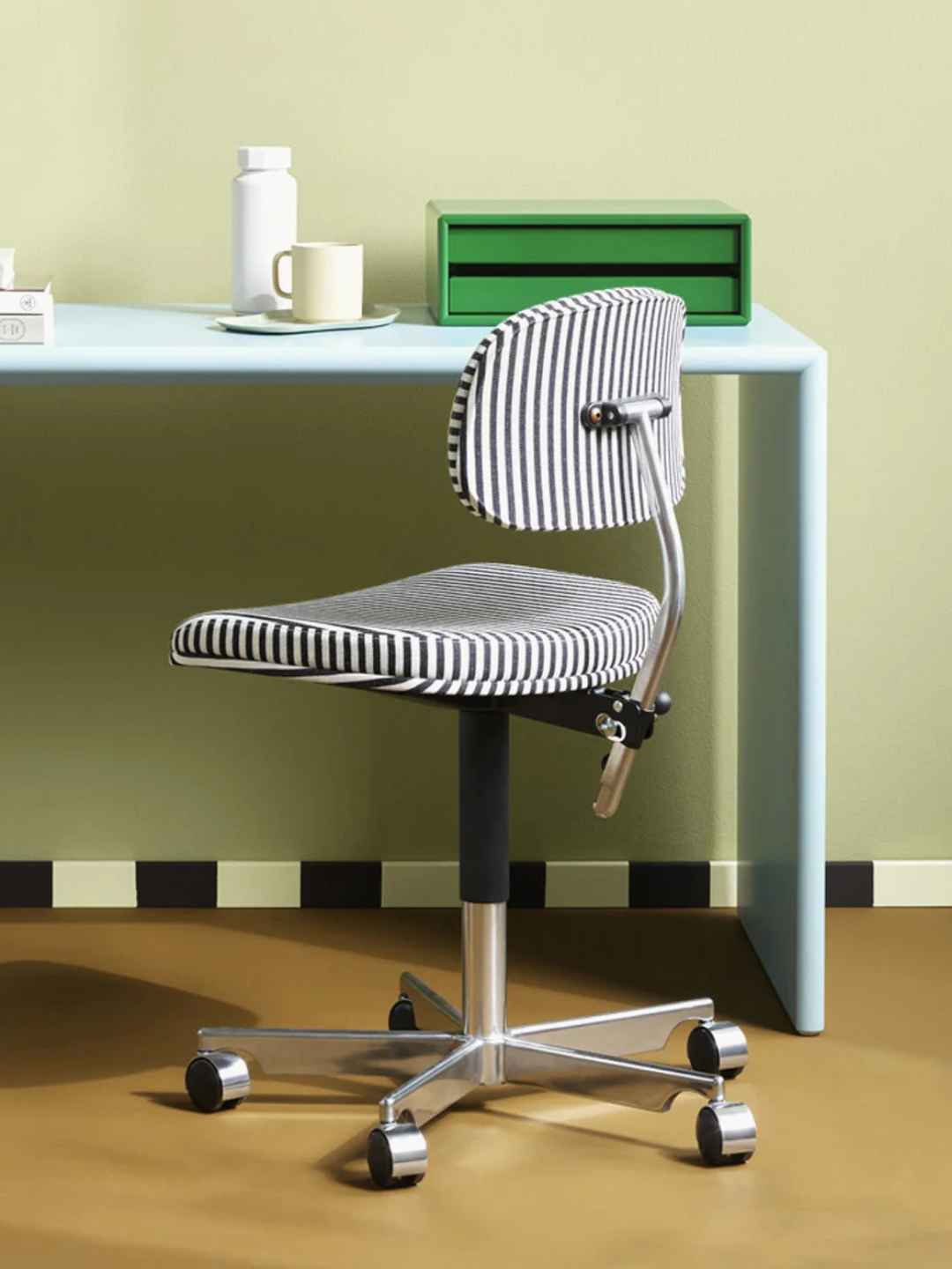 A striped black and white swivel office chair from Montana Furniture