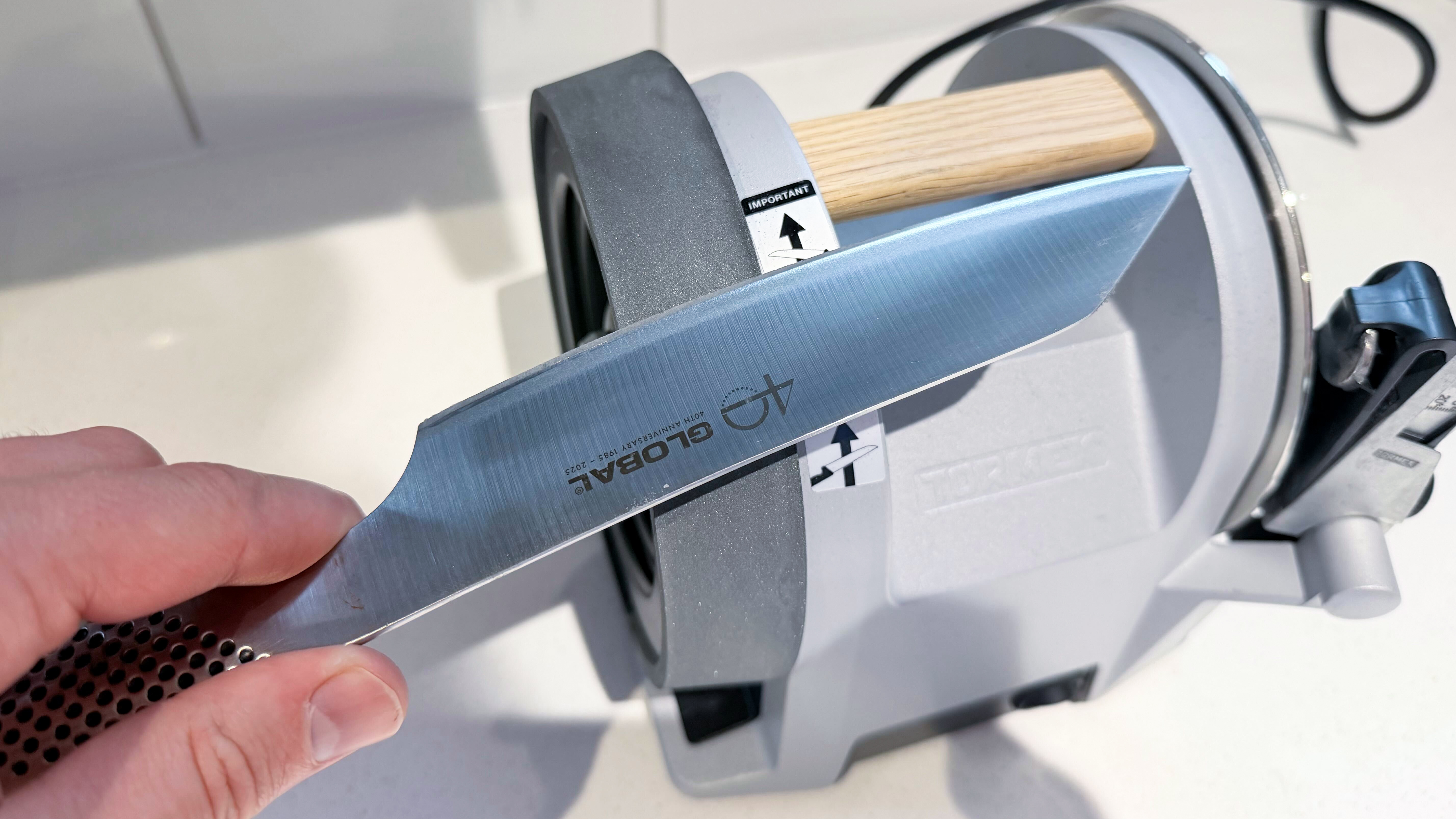 A knife being honed on the Tormek T-1 knife sharpener
