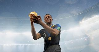 Kylian Mbappe of France celebrates with the World Cup Trophy following his sides victory in the 2018 FIFA World Cup Final between France and Croatia at Luzhniki Stadium on July 15, 2018 in Moscow, Russia.