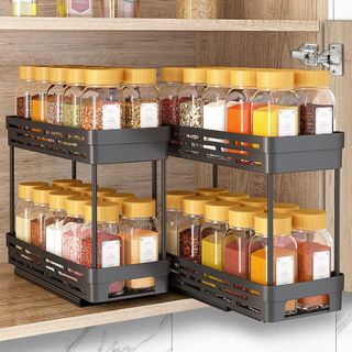 Set of 2 black pull out spice racks in a cupboard