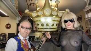 Toyah cand Robert in their kitchen with a large inflatable crown