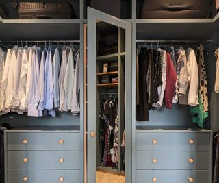 walk-in wardrobe with mirrored door and chests of drawers