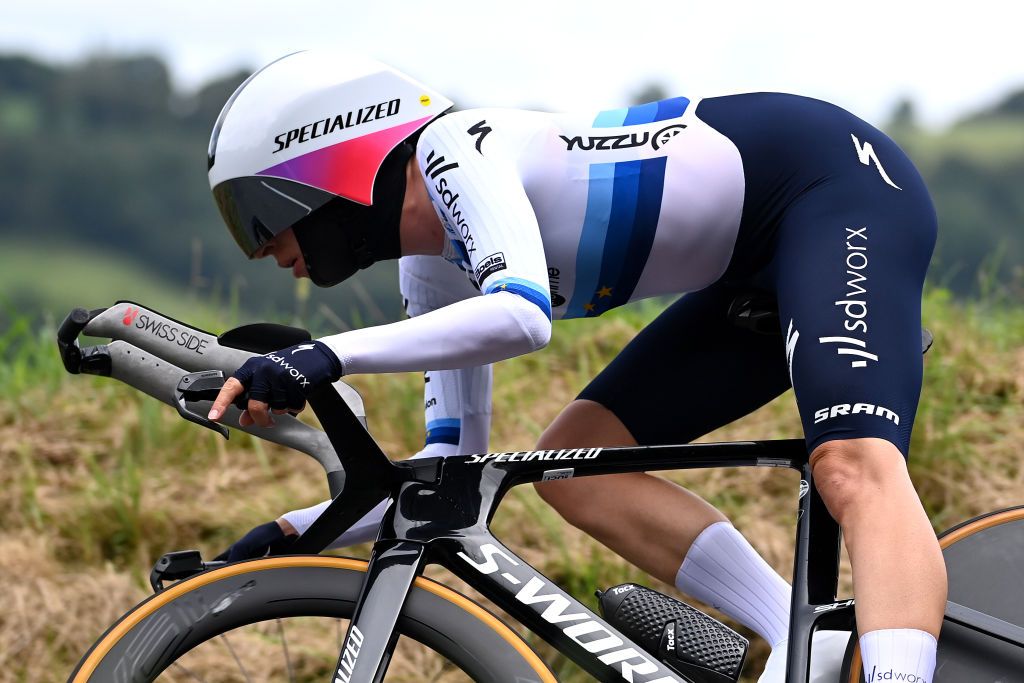 Marlen Reusser (SD Worx) flying on her TT bike with custom moulded TT handlebar extensions